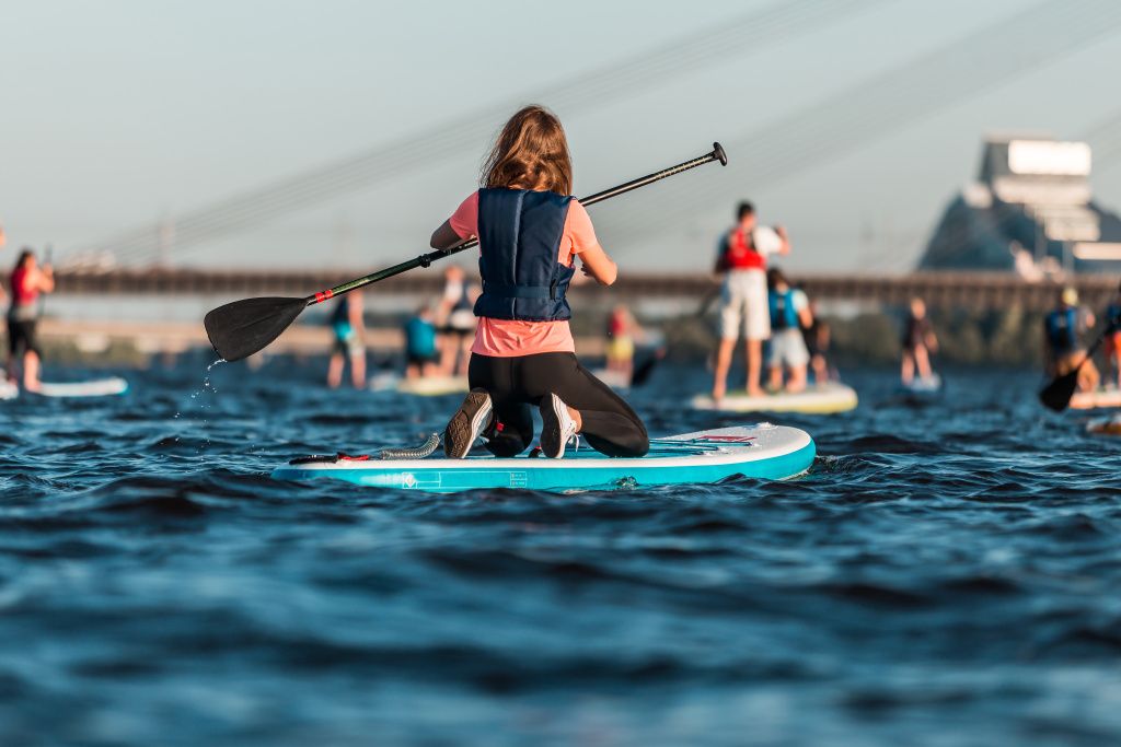 female-rowing-with-sup-paddle-boards-along-river.jpg